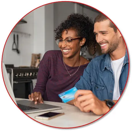 a couple doing online shopping in the kitchen