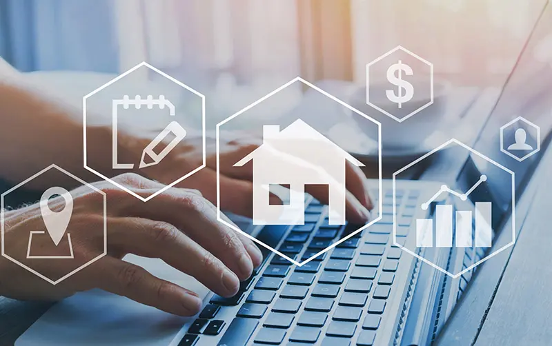 Typing on a keyboard with icons of a house, locations and graphs. Looking up Direct Mailing List Profiles and Data Appends