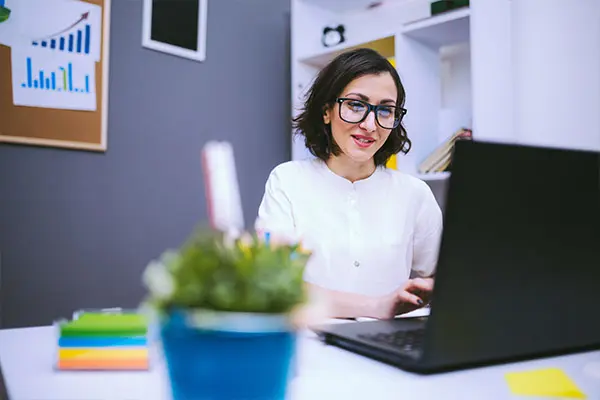 A woman working on NonProfit Fundraising Marketing