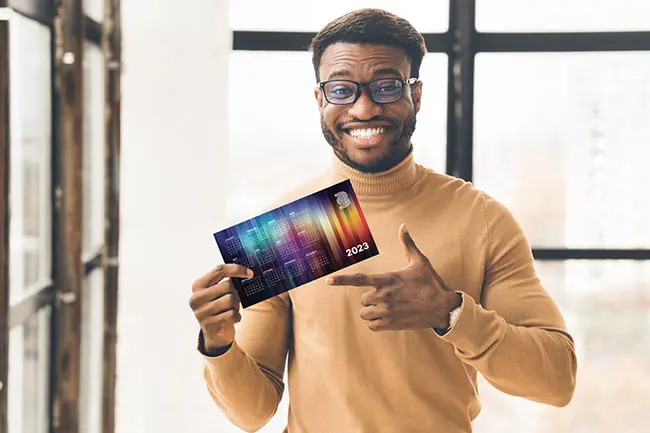 man holding calendar postcard