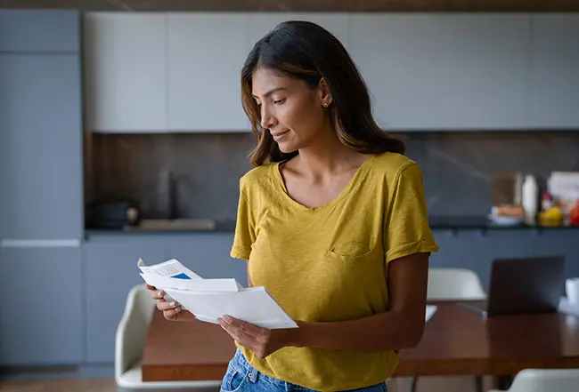 Woman Reading Mail at Home